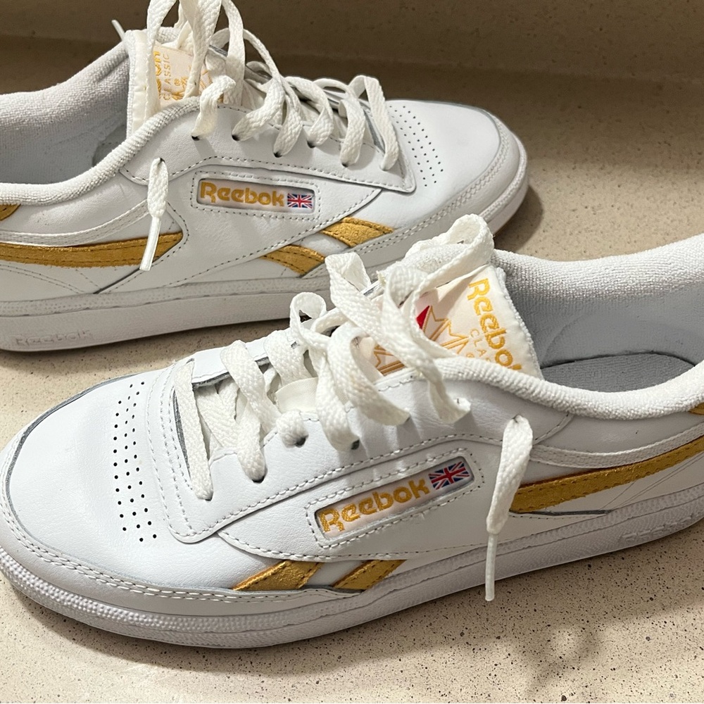 Reebok women’s White Sneakers with Gold Accents